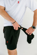 Athlete in black Apex performance running shorts by Nightclubs Suck
