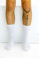 White Exo tall running socks worn by an athlete by Nightclubs Suck