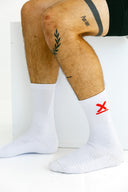White Exo tall socks with arch compression on model by Nightclubs Suck