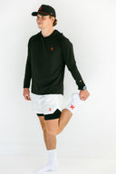 Runner in the black Flow lightweight hoodie and white Apex shorts by Nightclubs Suck