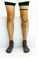 Gray low-cut Ghost running socks worn by an athlete by Nightclubs Suck