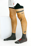 Gray Ghost running socks with arch compression on model by Nightclubs Suck