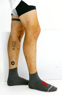 Gray mid Ghost performance socks side profile on model by Nightclubs Suck