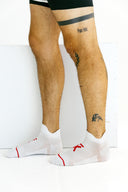 White low Ghost running socks with heel and toe padding by Nightclubs Suck