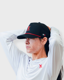 Black Redline performance running hat worn by a runner, by Nightclubs Suck