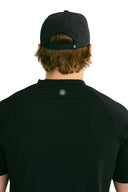 rear view of black performance hat with black X by Nightclubssuck