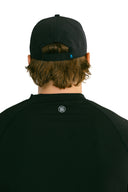 rear view of black performance hat with blue X by Nightclubssuck