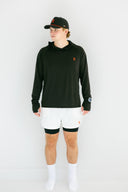 model wearing black performance hoodie with red X and watch cutout by Nightclubssuck