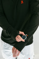 close up of watch cutout on model wearing black performance hoodie with red X by Nightclubssuck