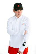 athlete wearing white performance tee with watch cutout and red X by Nightclubssuck