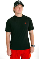 front view of model wearing black running shirt with red X by Nightclubssuck
