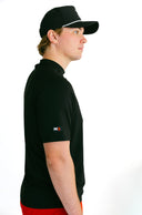 side profile of model wearing black performance tee with red X by Nightclubssuck