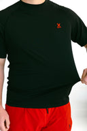 close up of model wearing black performance tee with red X by Nightclubssuck