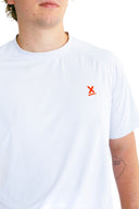 close up of red X on model wearing white performance tee with red X by Nightclubssuck